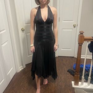Very unique black halter dress with sheer skirt and silk striping.